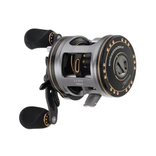 A low profile baitcasting reel, handle towards the camera.